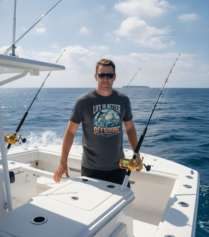 A man wearing a dark gray graphic t-shirt with 'LIFE IS BETTER OFFSHORE' and a fish illustration stands on a white boat deck with fishing rods against a blue ocean background.