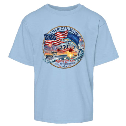 A light blue short-sleeve crewneck t-shirt featuring a circular graphic on the chest with an American flag, a jumping fish, a boat, and the text 'AMERICAN MADE', '250 ANNIIVERSARY', and 'Land of the Free SALTWATER LIFESTYLE'.
