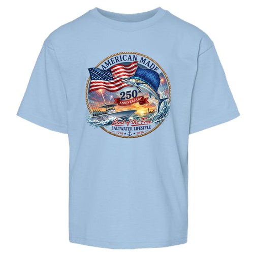 A light blue short-sleeve crewneck t-shirt featuring a circular graphic on the chest with an American flag, a jumping fish, a boat, and the text 'AMERICAN MADE', '250 ANNIIVERSARY', and 'Land of the Free SALTWATER LIFESTYLE'.